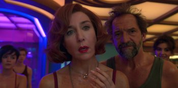 Movie still from “Big Bug” (2022), directed by Jean-Pierre Jeunet – A man and a woman standing next to each other; Close Up shot, Over the shoulder angle