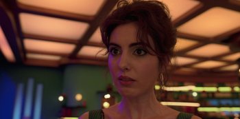 Movie still from “Big Bug” (2022), directed by Jean-Pierre Jeunet – A person wearing a dress; Close Up shot, Low angle