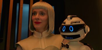 Movie still from “Big Bug” (2022), directed by Jean-Pierre Jeunet – A woman in a white dress and a robot; Close Up shot, Low angle