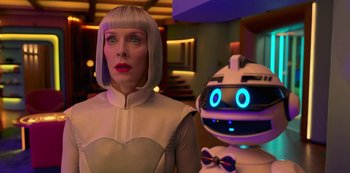 Movie still from “Big Bug” (2022), directed by Jean-Pierre Jeunet – A woman standing in front of a white robot; Close Up shot, Over the shoulder angle