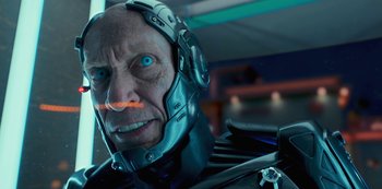Movie still from “Big Bug” (2022), directed by Jean-Pierre Jeunet – An old man with a strange face and blue eyes; Close Up shot, Low angle