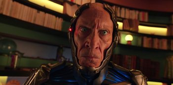 Movie still from “Big Bug” (2022), directed by Jean-Pierre Jeunet – An old man with a helmet on is looking at the camera; Close Up shot, Low angle