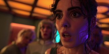 Movie still from “Big Bug” (2022), directed by Jean-Pierre Jeunet – A woman's face in front of another woman; Close Up shot, Low angle