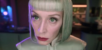 Movie still from “Big Bug” (2022), directed by Jean-Pierre Jeunet – A person wearing a wig; Close Up shot, Low angle