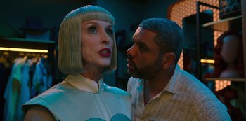 Movie still from “Big Bug” (2022), directed by Jean-Pierre Jeunet – A man and a woman standing next to each other; Close Up shot, Over the shoulder angle