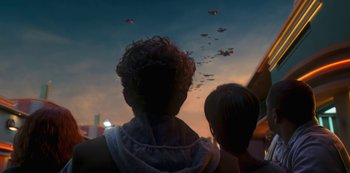Movie still from “Big Bug” (2022), directed by Jean-Pierre Jeunet – Two people looking out at a sky filled with planes; Extreme Wide shot, Over the shoulder angle