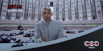 Movie still from “Big Bug” (2022), directed by Jean-Pierre Jeunet – A man in a gray suit sitting in front of a building; Medium shot, Low angle