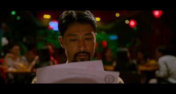 Movie still from “Da 5 Bloods” (2020), directed by Spike Lee – A person looking at a piece of paper; Close Up shot, Over the shoulder angle