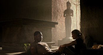 Movie still from “Da 5 Bloods” (2020), directed by Spike Lee – A man and a woman sitting on a bench; Wide shot, Over the shoulder angle