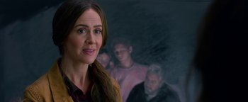 Movie still from “Bird Box” (2018), directed by Susanne Bier – A woman standing in front of a group of people; Close Up shot, Over the shoulder angle