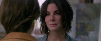 Movie still from “Bird Box” (2018), directed by Susanne Bier – A person with short hair; Close Up shot, Over the shoulder angle