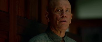 Movie still from “Bird Box” (2018), directed by Susanne Bier – An older man with a bald head looking up; Close Up shot, Low angle