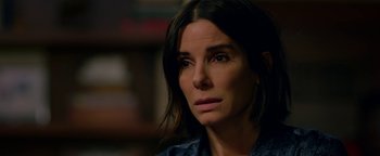 Movie still from “Bird Box” (2018), directed by Susanne Bier – A person with long dark hair; Close Up shot, Over the shoulder angle