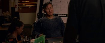 Movie still from “Bird Box” (2018), directed by Susanne Bier – A man sitting at a table in front of a map; Medium shot, Over the shoulder angle