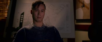 Movie still from “Bird Box” (2018), directed by Susanne Bier – A man standing in front of a whiteboard; Close Up shot, Over the shoulder angle