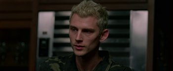 Movie still from “Bird Box” (2018), directed by Susanne Bier – A person wearing a camouflage shirt; Close Up shot, Over the shoulder angle