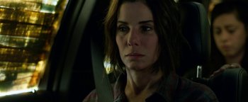 Movie still from “Bird Box” (2018), directed by Susanne Bier – A person sitting in a car; Close Up shot, Over the shoulder angle