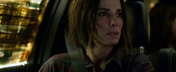 Movie still from “Bird Box” (2018), directed by Susanne Bier – A person sitting in a car; Close Up shot, Over the shoulder angle