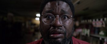 Movie still from “Bird Box” (2018), directed by Susanne Bier – A person wearing glasses; Extreme Close Up shot, Low angle