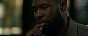 Movie still from “Bird Box” (2018), directed by Susanne Bier – A person with his hand under his chin; Close Up shot, Over the shoulder angle