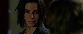 Movie still from “Bird Box” (2018), directed by Susanne Bier – A person wearing a jacket; Close Up shot, Over the shoulder angle