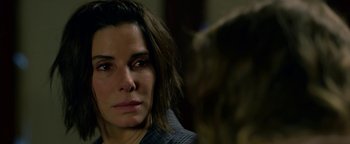 Movie still from “Bird Box” (2018), directed by Susanne Bier – A woman that is staring at the camera; Close Up shot, Over the shoulder angle