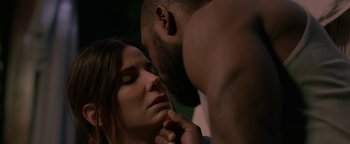 Movie still from “Bird Box” (2018), directed by Susanne Bier – A man and a woman are touching each other's face; Close Up shot, Over the shoulder angle