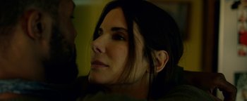 Movie still from “Bird Box” (2018), directed by Susanne Bier – A person with long hair; Close Up shot, Over the shoulder angle