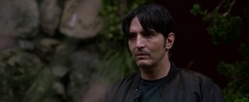 Movie still from “Bird Box” (2018), directed by Susanne Bier – A person wearing a black jacket; Close Up shot, Over the shoulder angle