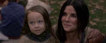 Movie still from “Bird Box” (2018), directed by Susanne Bier – A woman and a child are posing for a picture; Close Up shot, High angle