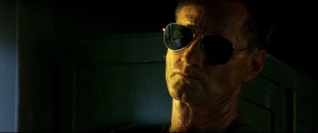 Movie still from “Black Hawk Down” (2001), directed by Ridley Scott – A person wearing sunglasses; Close Up shot, Low angle