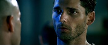 Movie still from “Black Hawk Down” (2001), directed by Ridley Scott – A man's face with blue light shining on him; Close Up shot, Low angle