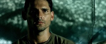 Movie still from “Black Hawk Down” (2001), directed by Ridley Scott – A person wearing a necklace; Close Up shot, Low angle