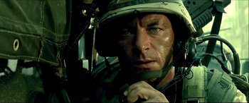 Movie still from “Black Hawk Down” (2001), directed by Ridley Scott – A person wearing a helmet; Close Up shot, Low angle