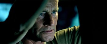 Movie still from “Black Hawk Down” (2001), directed by Ridley Scott – An older man with blue eyes stares into the distance; Close Up shot, Over the shoulder angle