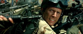 Movie still from “Black Hawk Down” (2001), directed by Ridley Scott – A person wearing a helmet; Close Up shot, Low angle