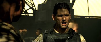 Movie still from “Black Hawk Down” (2001), directed by Ridley Scott – A person wearing a body armor; Close Up shot, Low angle