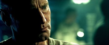 Movie still from “Black Hawk Down” (2001), directed by Ridley Scott – A man's face in the sunlight; Close Up shot, Low angle