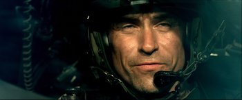 Movie still from “Black Hawk Down” (2001), directed by Ridley Scott – A person wearing a helmet; Close Up shot, Low angle
