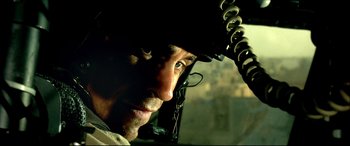 Movie still from “Black Hawk Down” (2001), directed by Ridley Scott – A person wearing a helmet; Close Up shot, Low angle