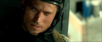 Movie still from “Black Hawk Down” (2001), directed by Ridley Scott – A person wearing a helmet; Close Up shot, High angle