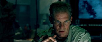 Movie still from “Black Hawk Down” (2001), directed by Ridley Scott – A person wearing a military uniform; Close Up shot, Low angle