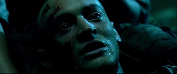 Movie still from “Black Hawk Down” (2001), directed by Ridley Scott – A man's face covered in blood; Close Up shot, High angle
