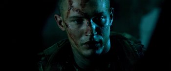Movie still from “Black Hawk Down” (2001), directed by Ridley Scott – A person with blood all over his face; Close Up shot, Low angle