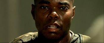 Movie still from “Black Hawk Down” (2001), directed by Ridley Scott – A man's face with water droplets on it; Extreme Close Up shot, Low angle