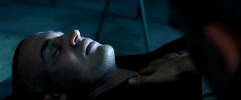 Movie still from “Black Hawk Down” (2001), directed by Ridley Scott – A man laying on the ground with his eyes closed; Close Up shot, High angle