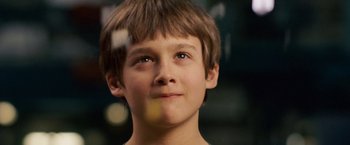 Movie still from “Dear John” (2010), directed by Lasse Hallström – A young boy's face looking up; Close Up shot, Low angle