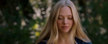 Movie still from “Dear John” (2010), directed by Lasse Hallström – A woman with long blonde hair looking down at her face; Close Up shot, Over the shoulder angle