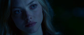 Movie still from “Dear John” (2010), directed by Lasse Hallström – A woman's face in the dark; Close Up shot, Over the shoulder angle