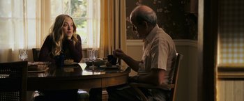 Movie still from “Dear John” (2010), directed by Lasse Hallström – An older man sitting at a table with a woman; Medium shot, Over the shoulder angle